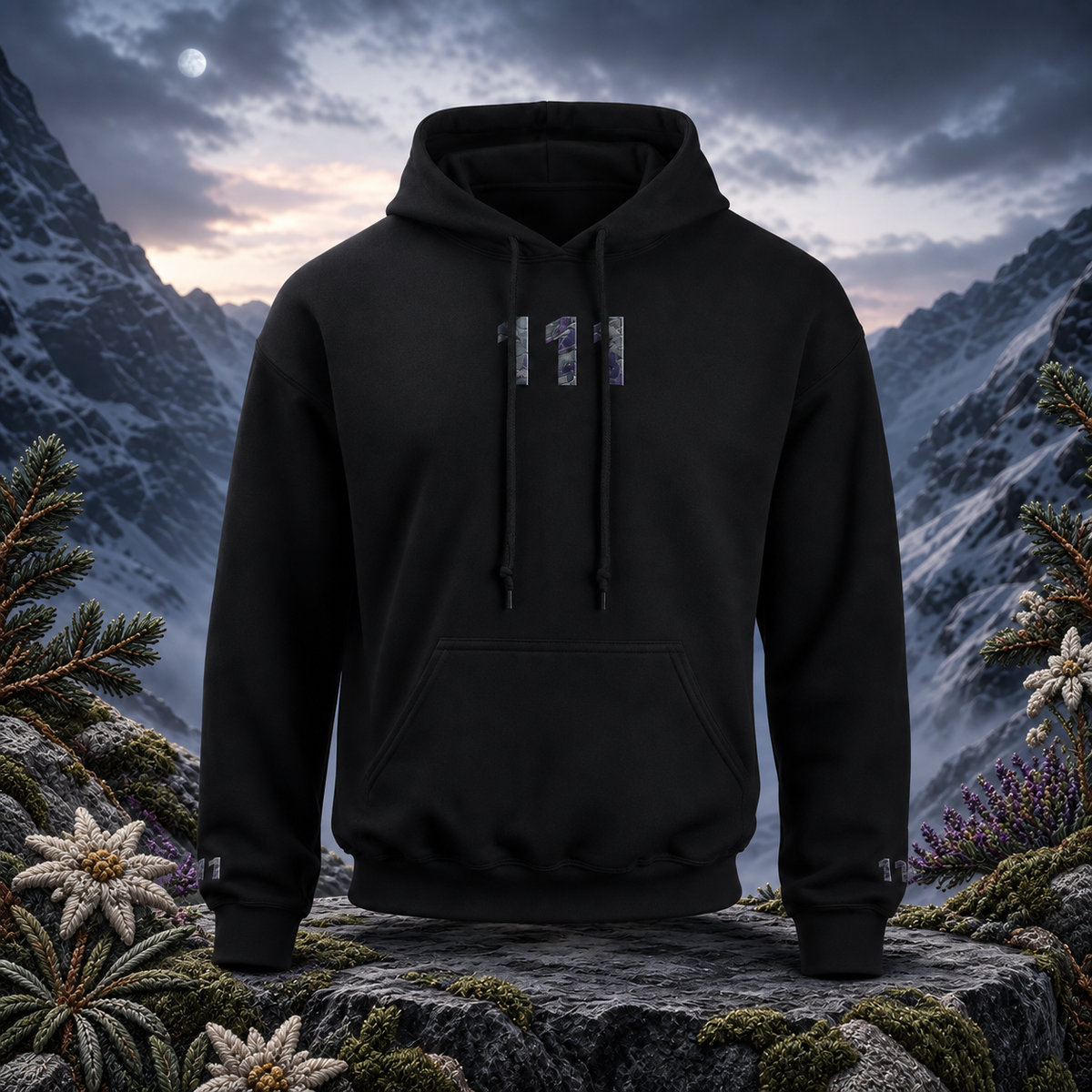 111 Snowy Mountain Angel Number Hoodie in Black – Bright Future product image — original product in a realistic nature scene with embroidered environmental details.
