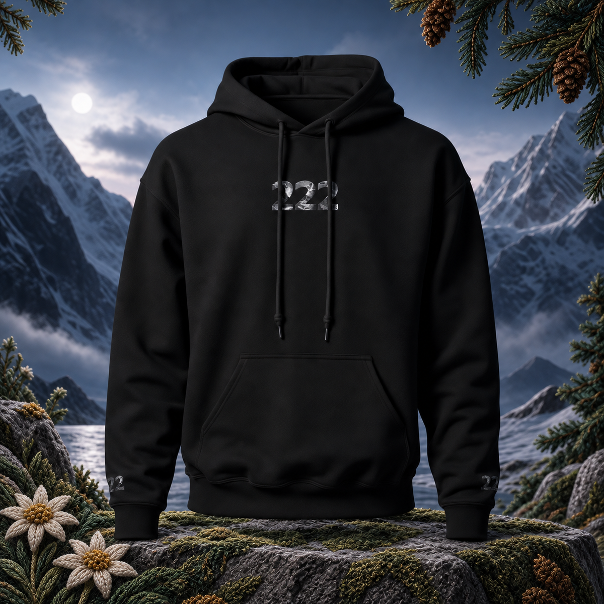 222 Snowy Mountain Angel Number Hoodie in Black – Bright Future product image — original product in a realistic nature scene with embroidered environmental details.