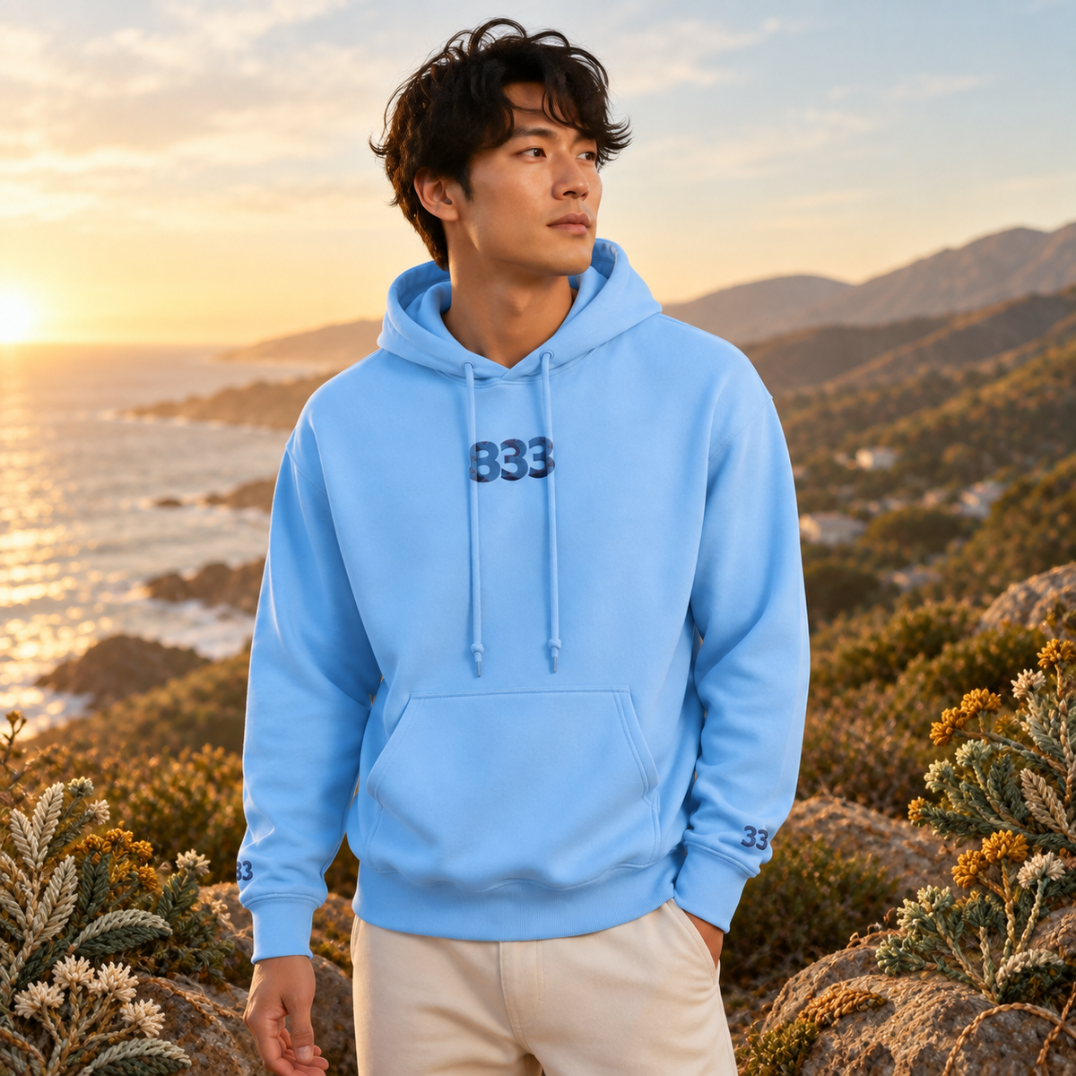 333 Ocean Angel Number Hoodie in Light Blue β Bright Future product image β realistic model in an embroidered nature scene.
