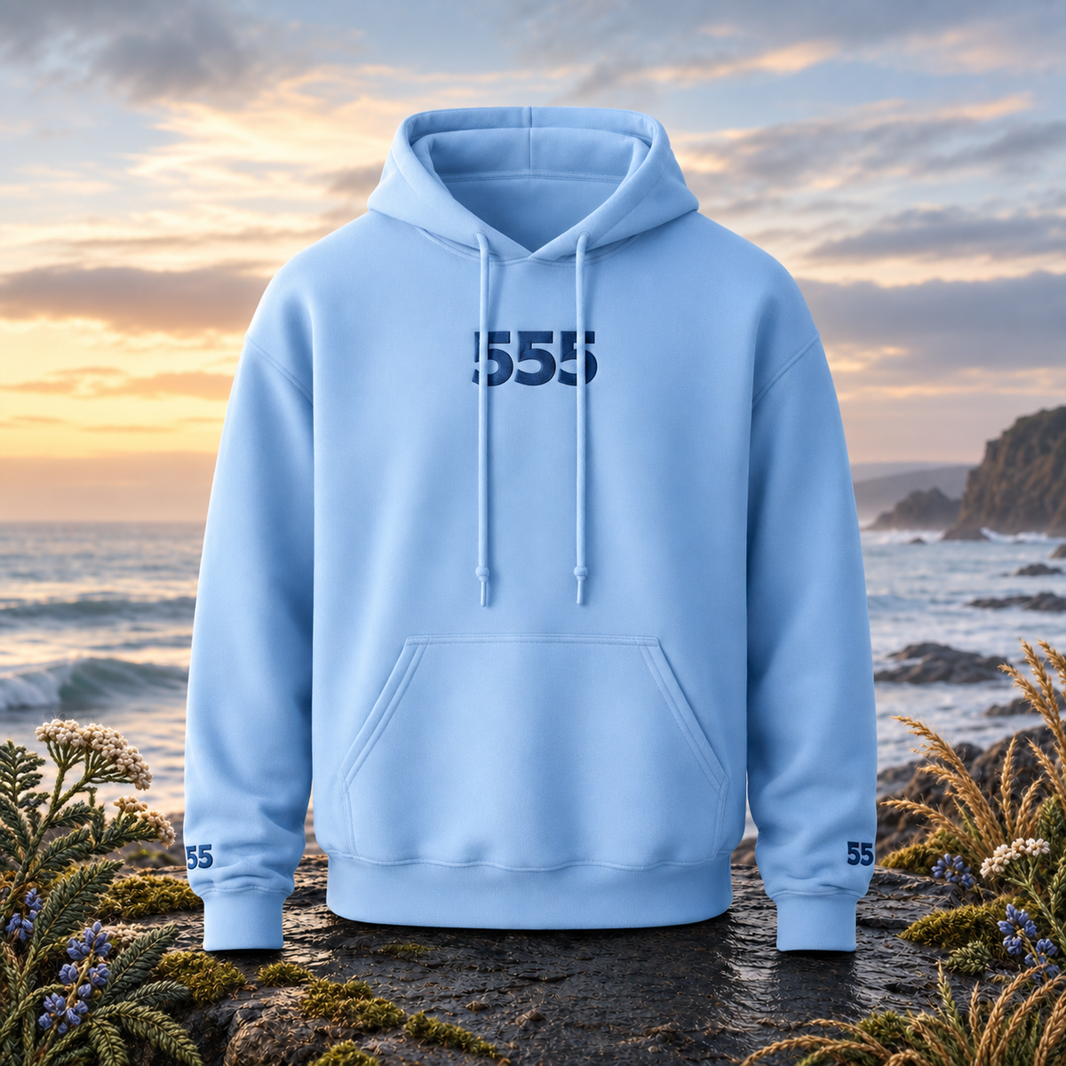 555 Ocean Angel Number Hoodie in Carolina Blue β Bright Future product image β original product in a realistic nature scene with embroidered environmental details.