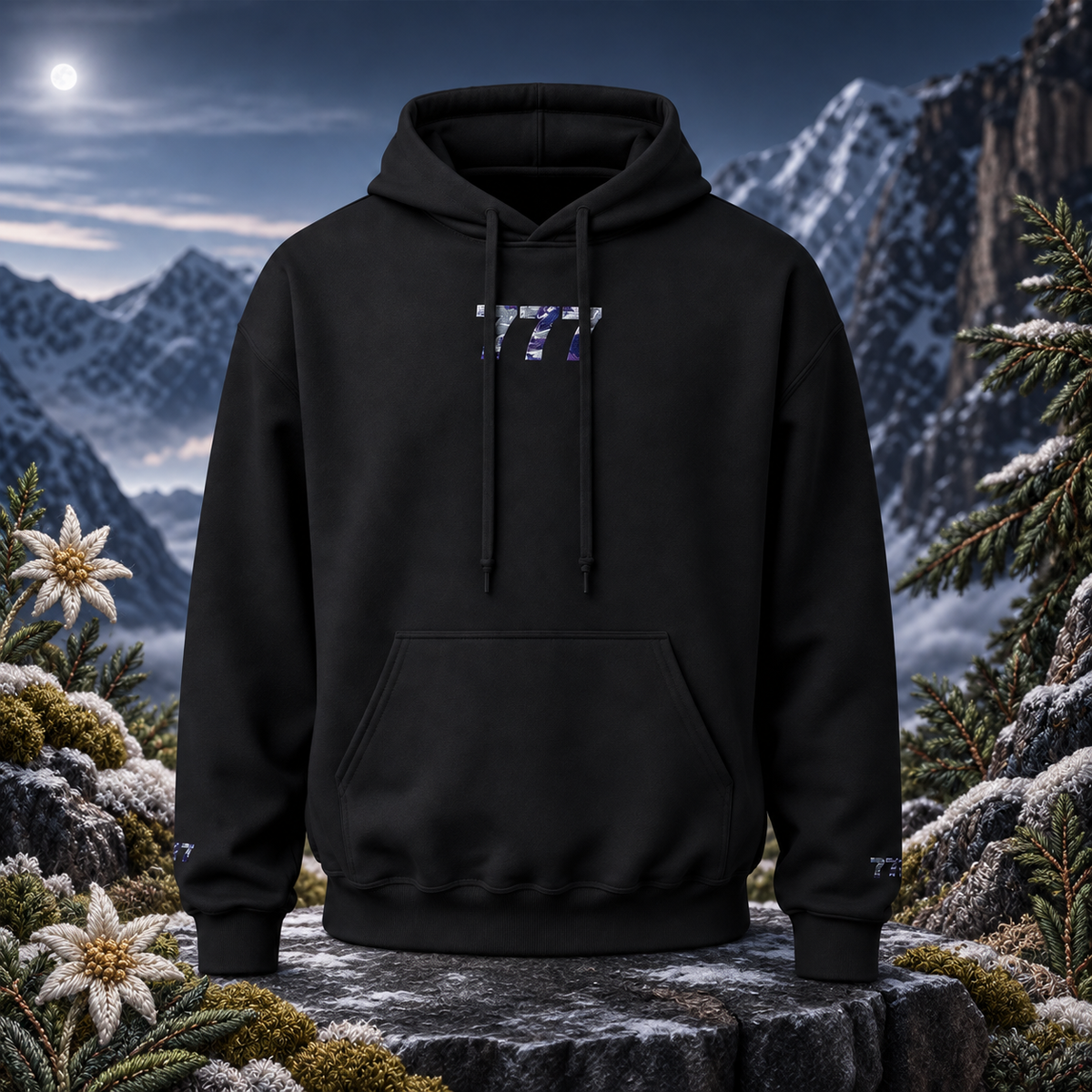 777 Snowy Mountain Angel Number Hoodie in Black – Bright Future product image — original product in a realistic nature scene with embroidered environmental details.