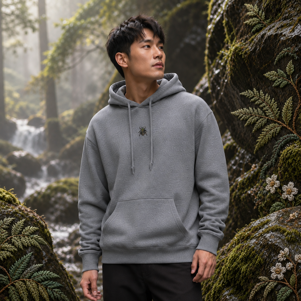 Beetle Hoodie – Resilience & Renewal in Graphite Heather – Bright Future product image — realistic model in an embroidered nature scene.
