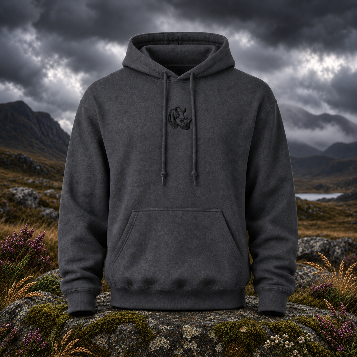 The Rhino – Determination, Protection & Grounded Strength — original product design in a realistic scene with embroidered environmental details.