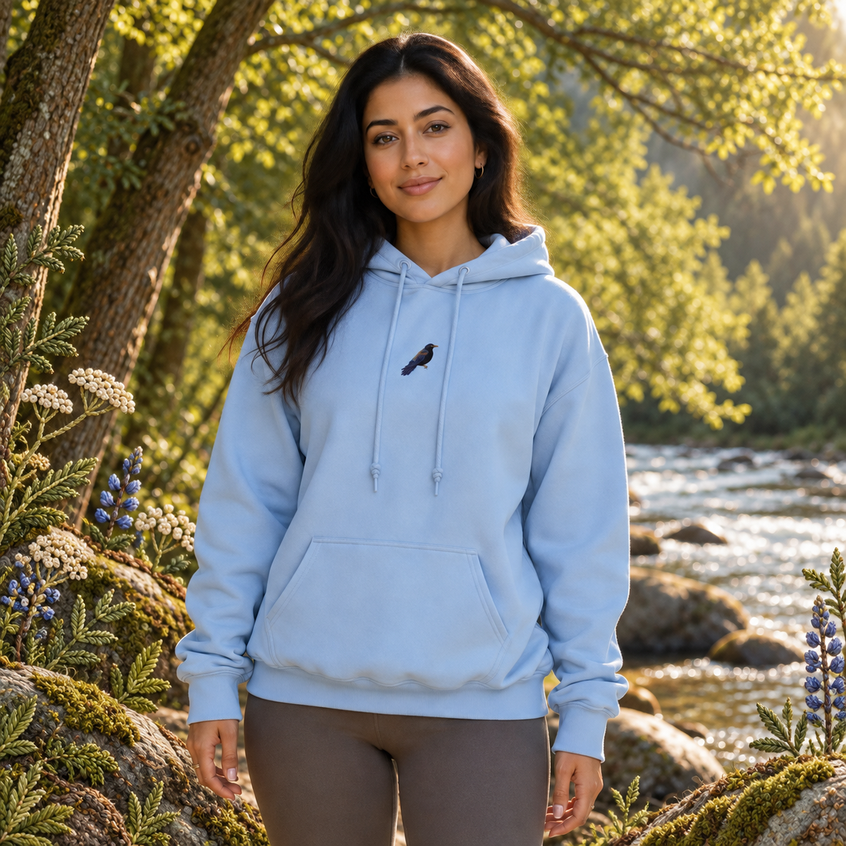 Blackbird Hoodie in Light Blue – Bright Future product image — realistic model in an embroidered nature scene.
