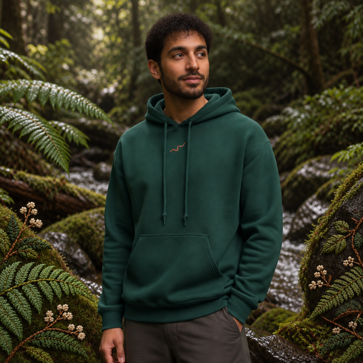 Earthworm Hoodie Hoodie – Growth & Renewal in Forest Green – Bright Future product image — realistic model in an embroidered nature scene.