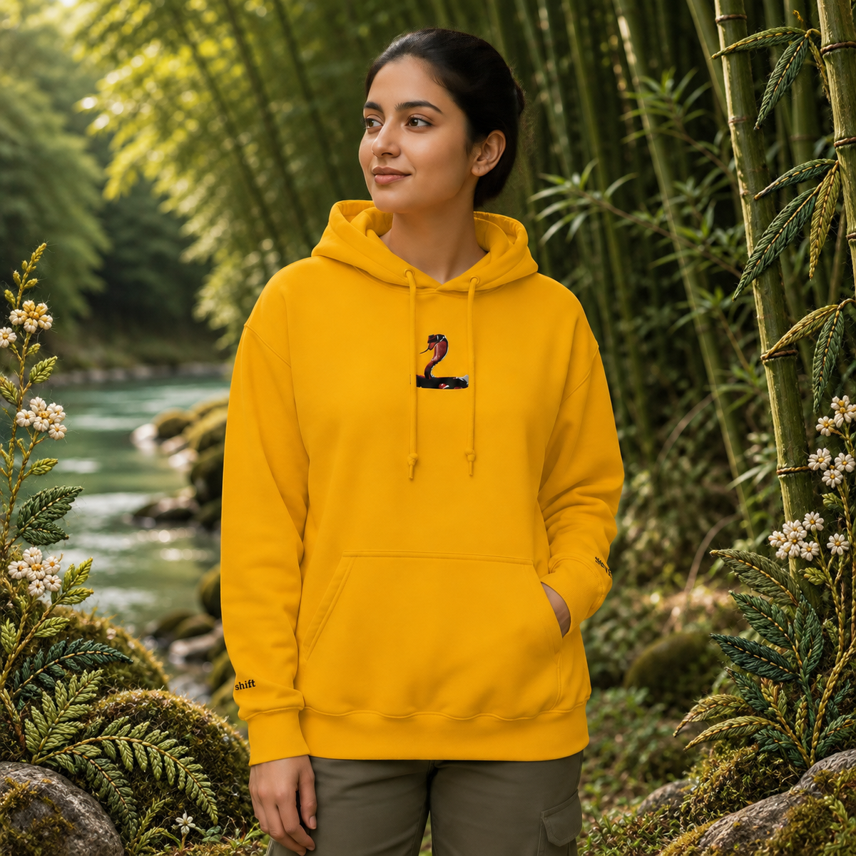 Snake Chinese Zodiac Hoodie in Gold – Bright Future product image — realistic model in an embroidered nature scene.