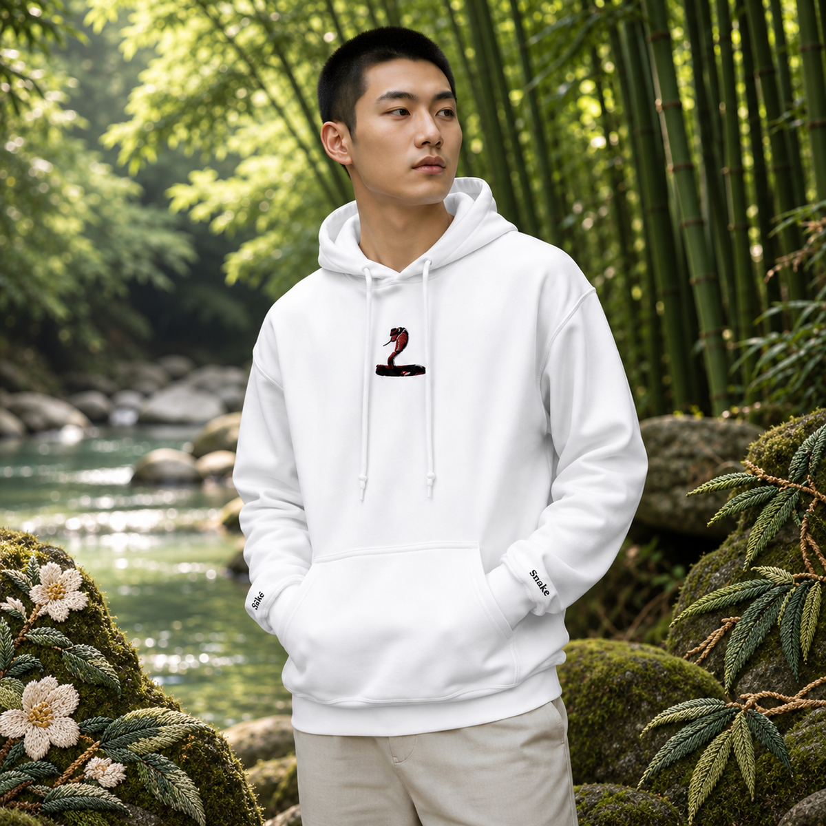 Snake Chinese Zodiac Hoodie in White – Bright Future product image — realistic model in an embroidered nature scene.