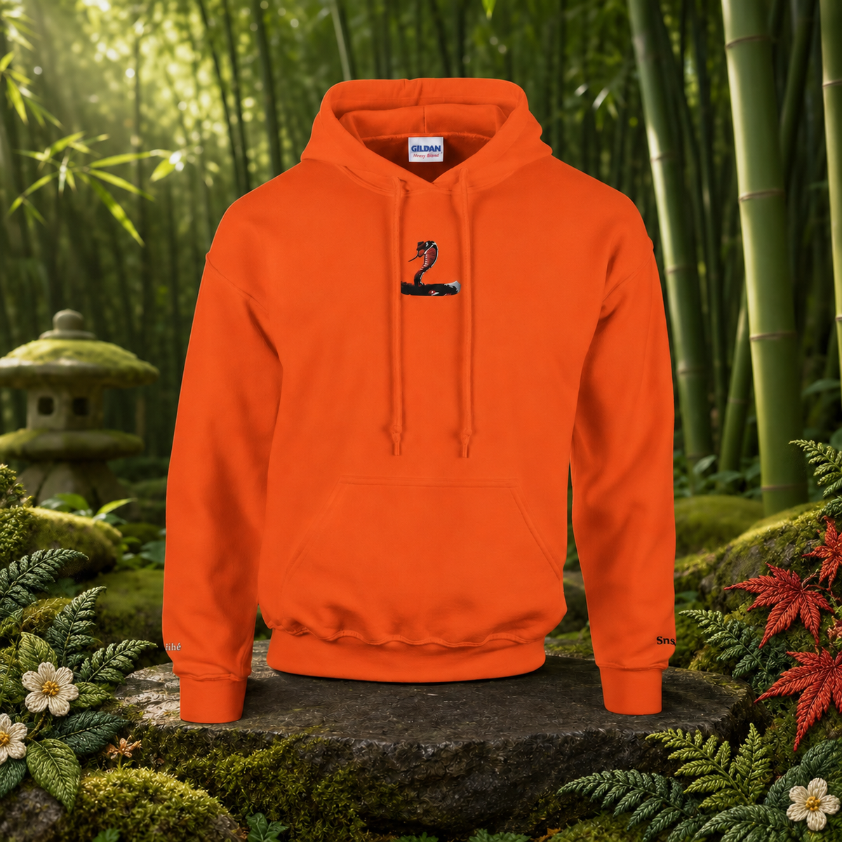 Snake Chinese Zodiac Hoodie in Orange – Bright Future product image — original product in a realistic nature scene with embroidered environmental details.