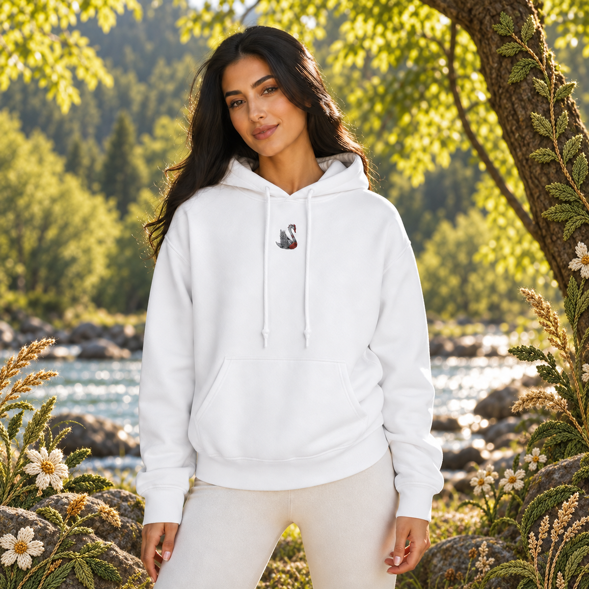 Swan Hoodie in White – Bright Future product image — realistic model in an embroidered nature scene.