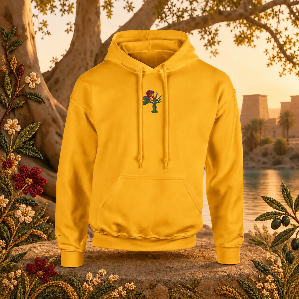 Lady of the Sycamore Symbol Hoodie in Gold – Bright Future product image — original product in a realistic nature scene with embroidered environmental details.