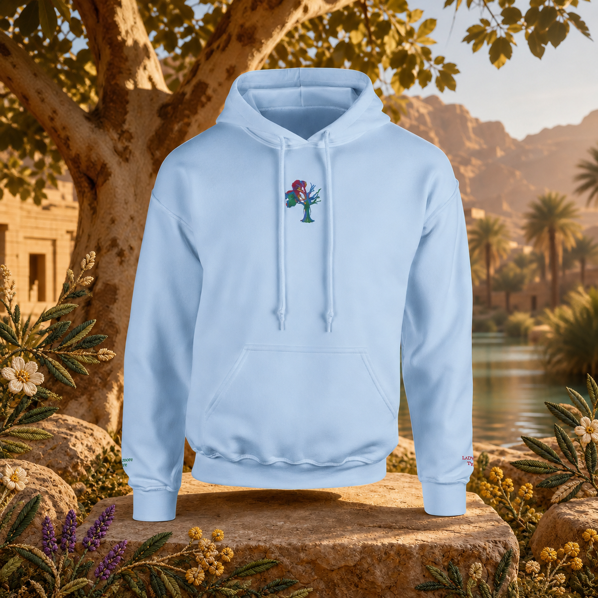 Lady of the Sycamore Symbol Hoodie in Light Blue – Bright Future product image — original product in a realistic nature scene with embroidered environmental details.