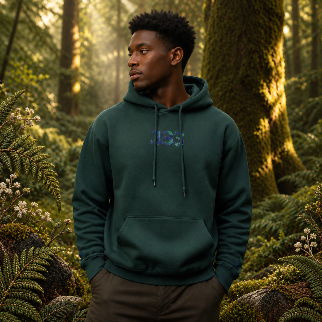 333 Forest Angel Number Hoodie in Forest Green – Bright Future product image — realistic model in an embroidered nature scene.