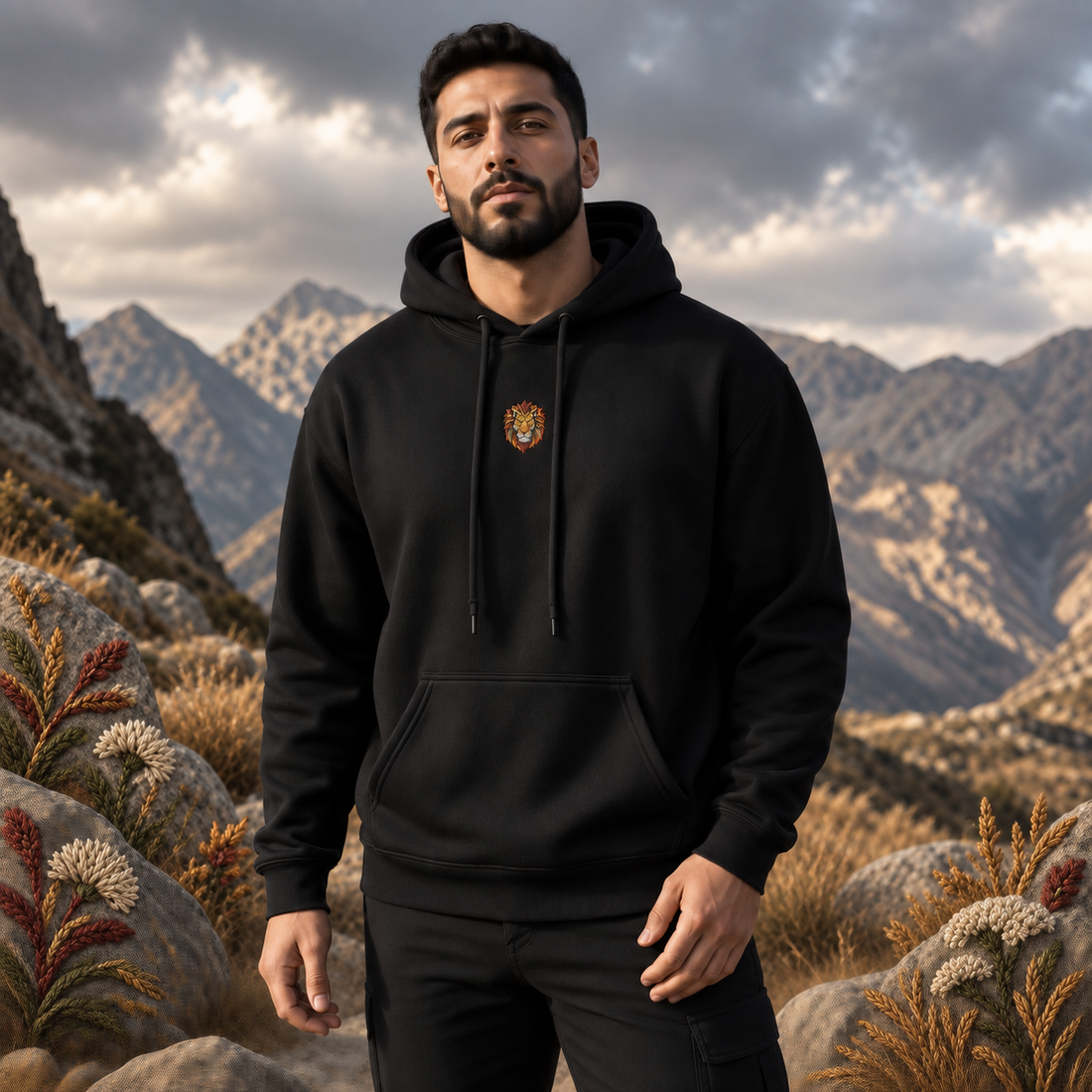 Lion Hoodie – Strength, Power & Confidence in Black – Bright Future product image — realistic model in an embroidered nature scene.